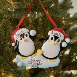 Penguin Couple Throwing Snowballs Personalized Christmas Ornament OR1318 -The Jolly Christmas Shop api5rhvis 93096.1646091889
